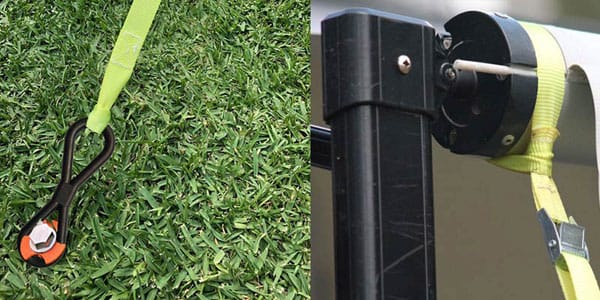 closer image of ground dog elastic safety spring ratchet attached to green lawn