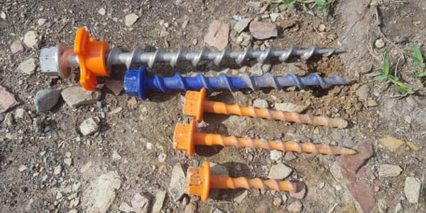 upper view of ground dog and plastic screw kept on construction site or ground